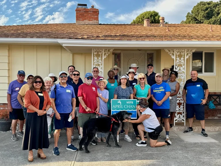 EBMUD Ward 7 Director April Chan with a crowd of supporters and a Vote April Chan sign at a neighborhood meet and greet in San Leandro’s Bay-O-Vista area