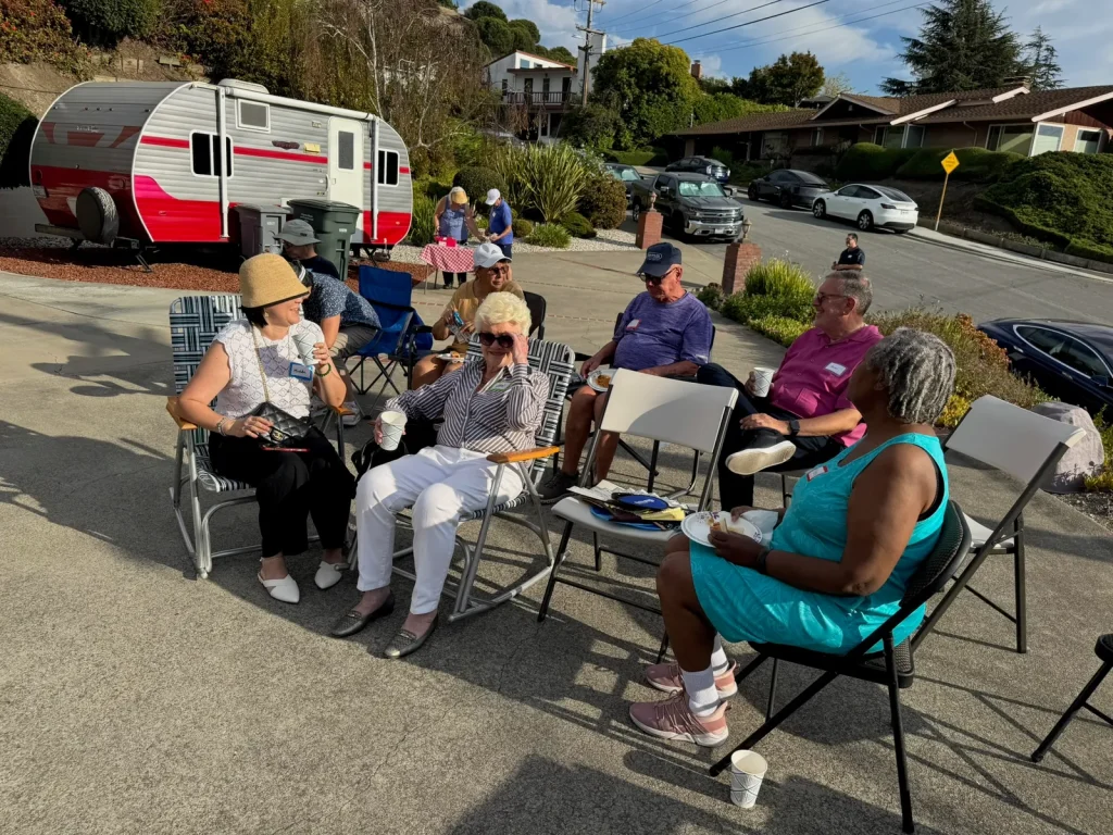 San Leandro neighbors talking in lawn chairs at a meet and greet for EBMUD Ward 7 Director April Chan
